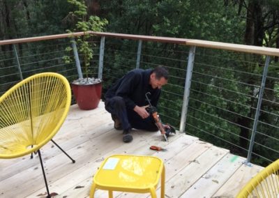 electrician installing deck lights