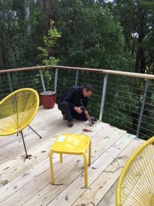 electrician installing deck lights